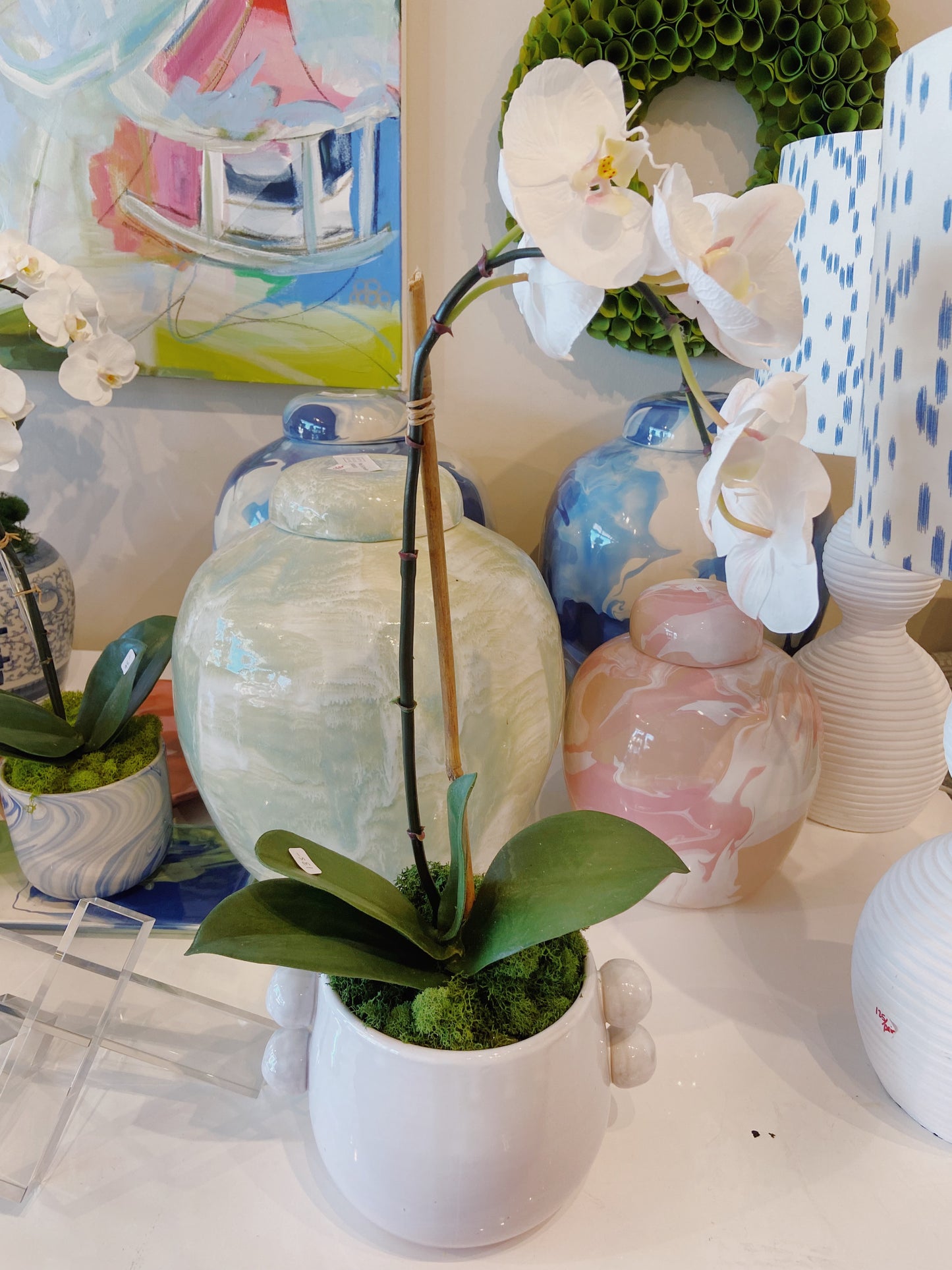 White orchid in bubble pot